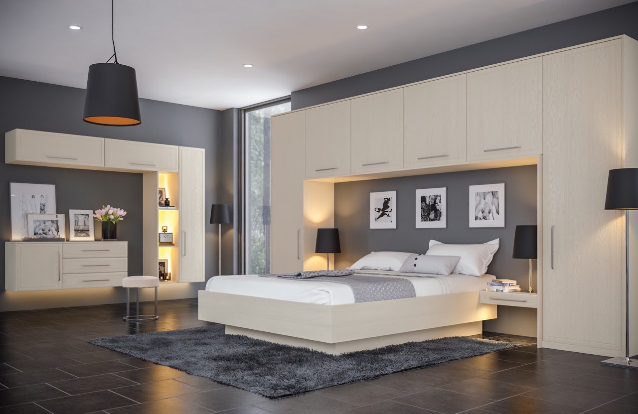 Bedroom with the bed centred in a fitted furniture alcove