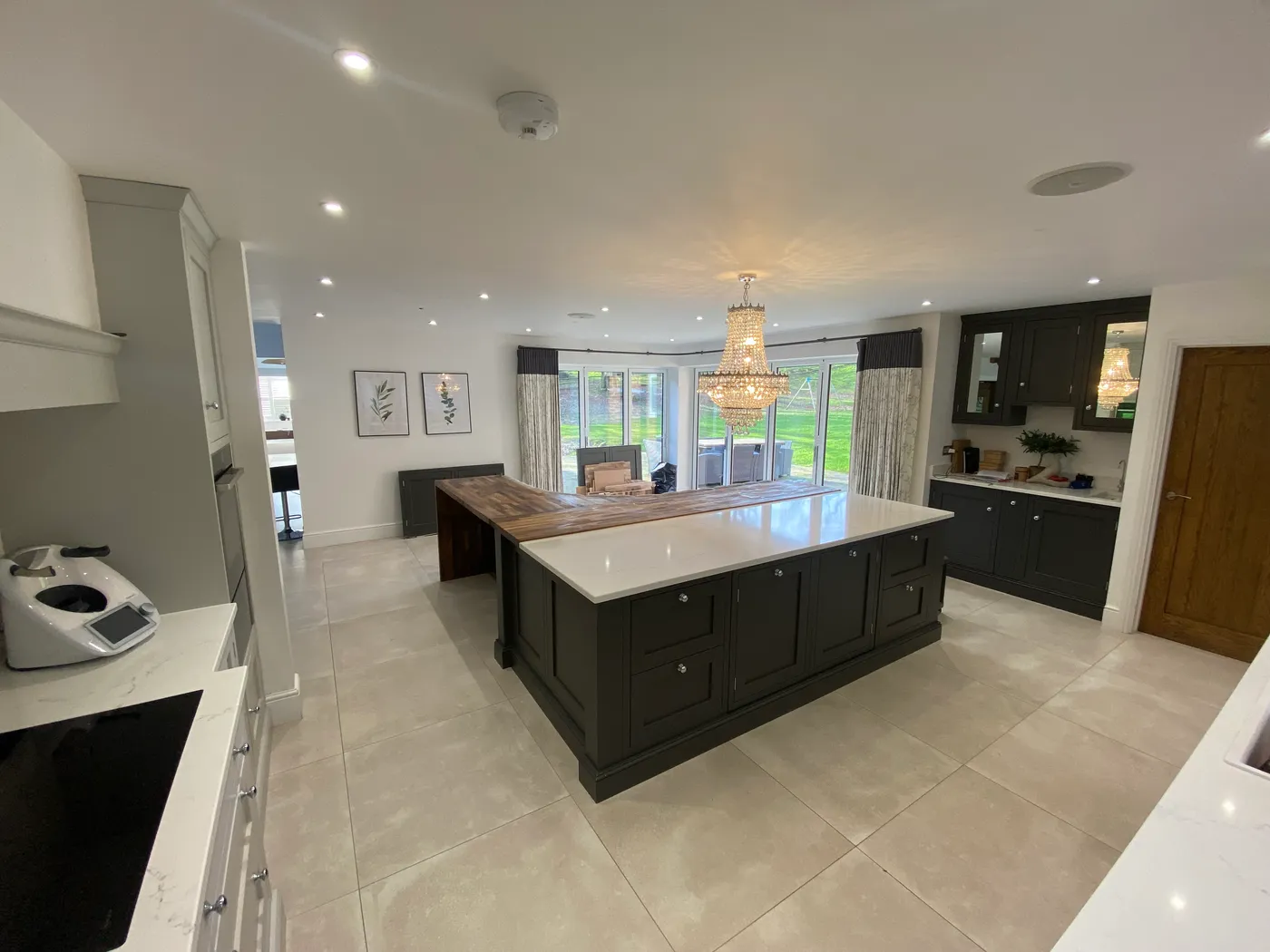 Open-Plan Kitchen Island with Banquette Seating — project photo