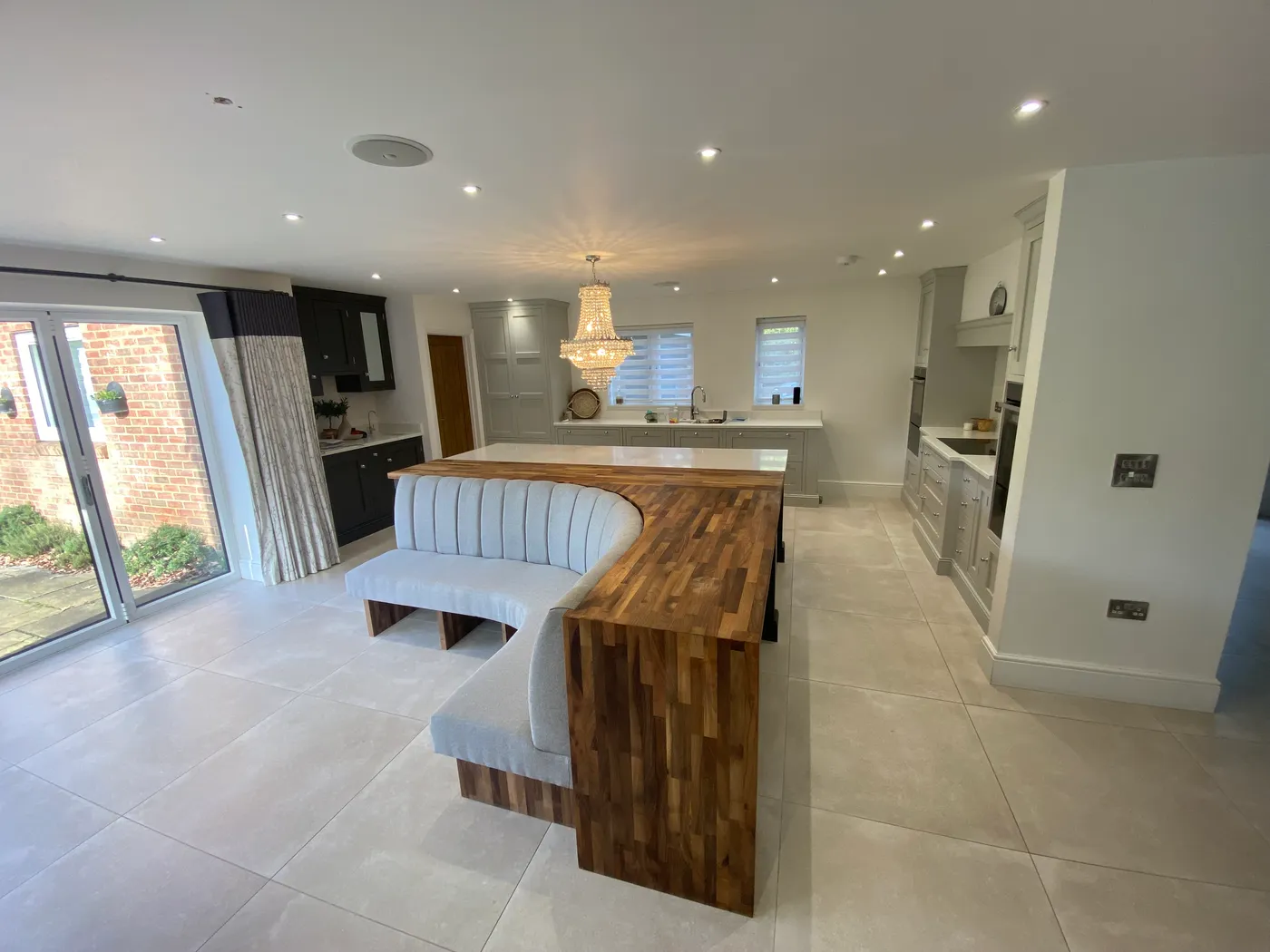 Open-Plan Kitchen Island with Banquette Seating — project photo