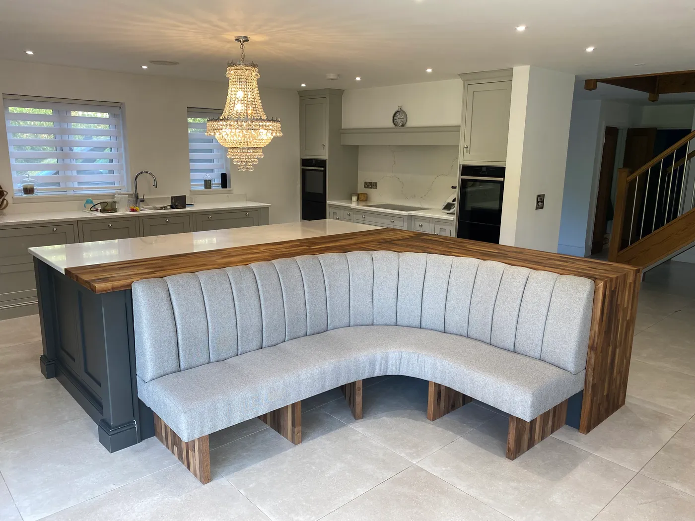 Open-Plan Kitchen Island with Banquette Seating — project photo