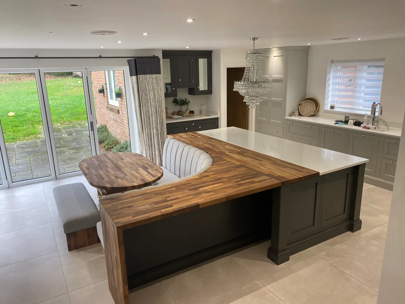 Open-Plan Kitchen Island with Banquette Seating — project photo