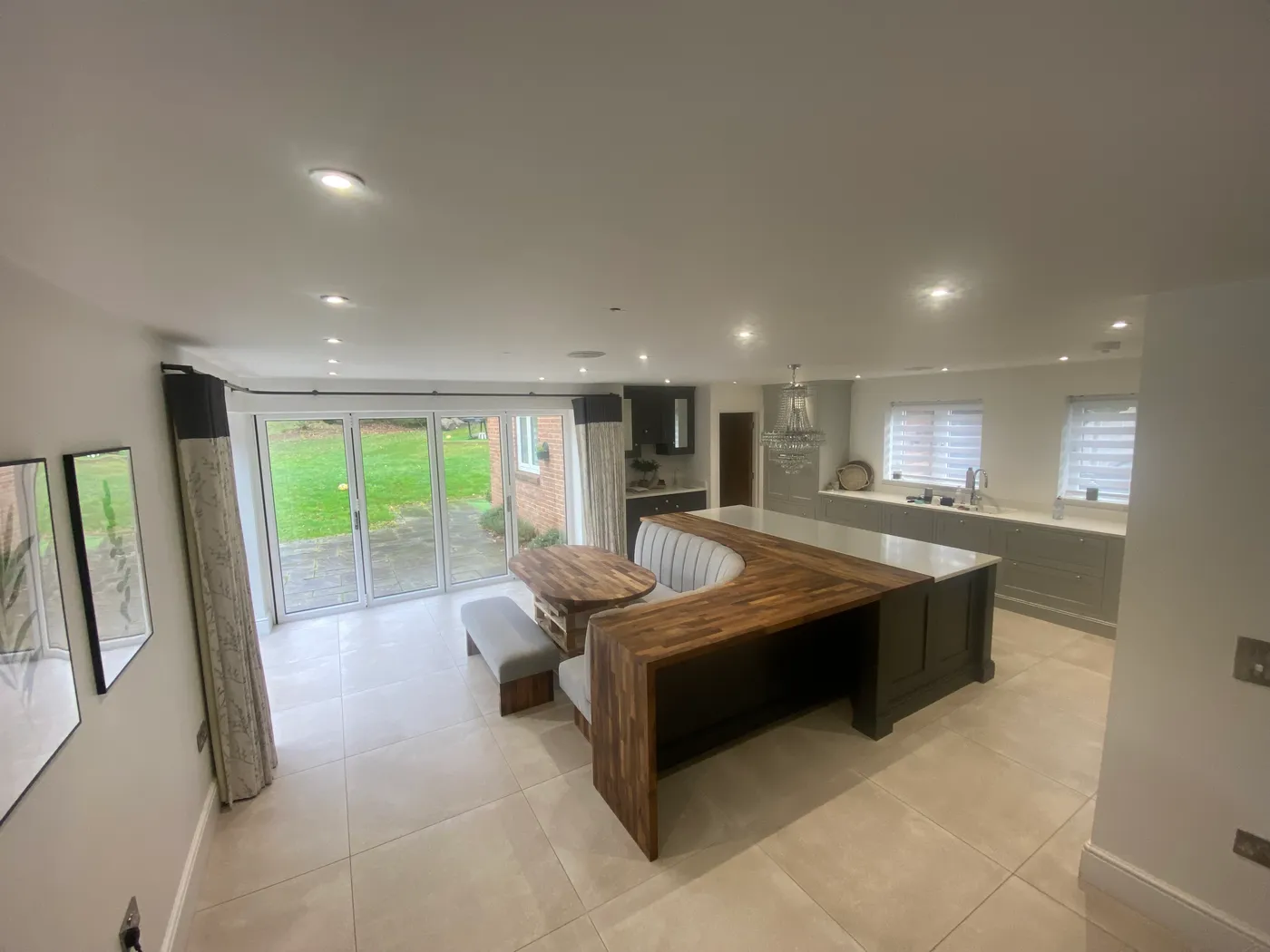 Open-Plan Kitchen Island with Banquette Seating — project photo