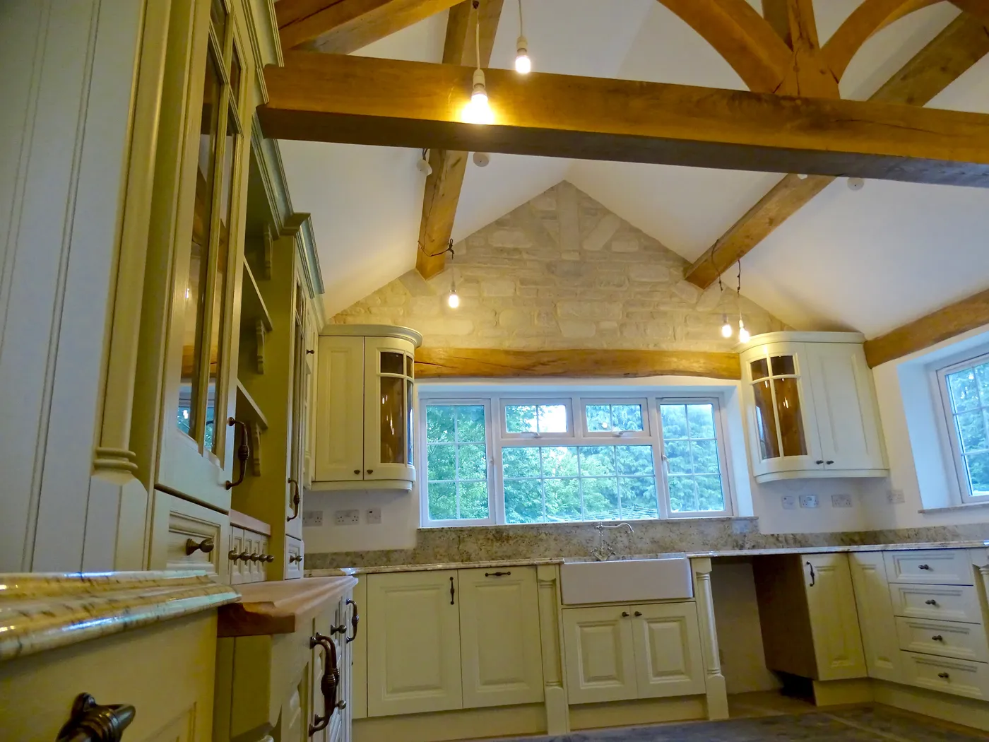 Sage Green Farmhouse Kitchen with Oak Beams — project photo