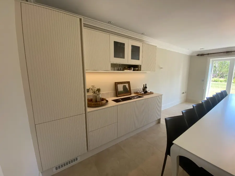 Cream fluted bar beside white dining table