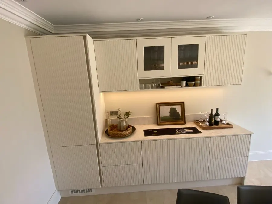 Bar counter styled with wine bottles and glasses