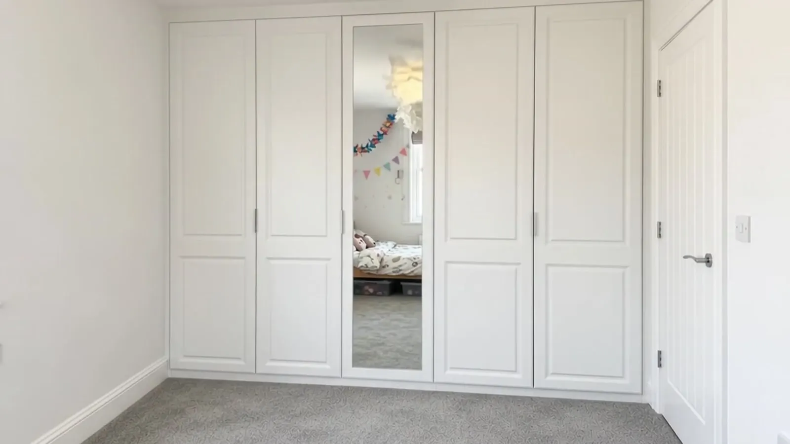 White fitted wardrobe with dressing vanity, Hollywood mirror and soft pink stool